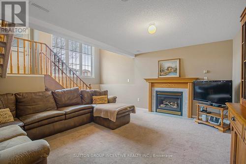 27 White Elm Rd, Barrie, ON - Indoor Photo Showing Living Room With Fireplace