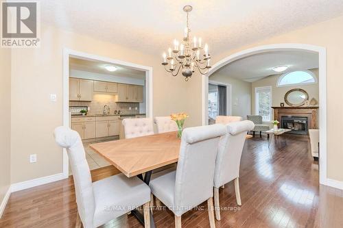 7 Henderson Dr, Guelph, ON - Indoor Photo Showing Dining Room With Fireplace
