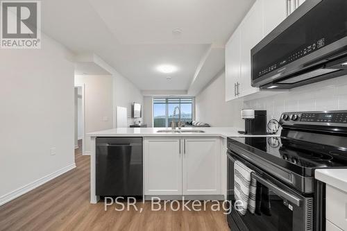 #215 -2750 King St E, Hamilton, ON - Indoor Photo Showing Kitchen With Double Sink
