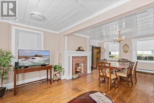 592 Simmons Rd, Loyalist, ON - Indoor Photo Showing Dining Room With Fireplace