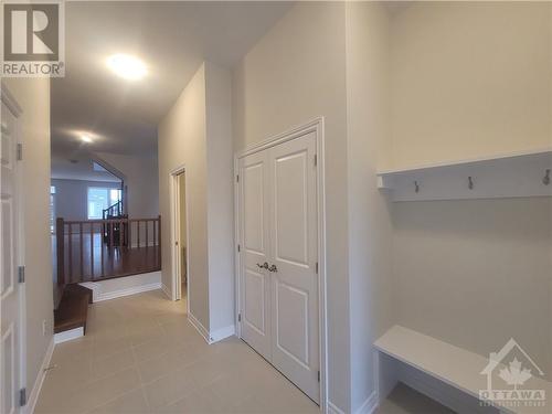 Welcoming Foyer with built-in shelving & spacious closet - 633 Fisher Street, Kemptville, ON - Indoor Photo Showing Other Room