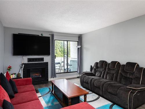 118-290 Regina Ave, Saanich, BC - Indoor Photo Showing Living Room With Fireplace