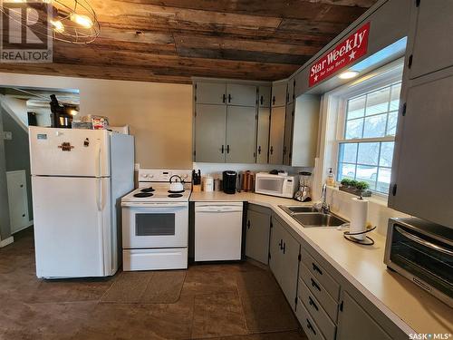 148 Grenfell Beach, Crooked Lake, SK - Indoor Photo Showing Kitchen With Double Sink