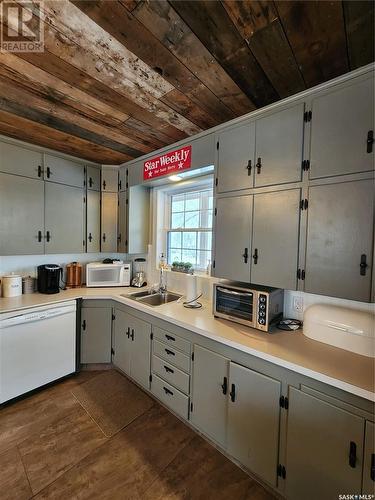 148 Grenfell Beach, Crooked Lake, SK - Indoor Photo Showing Kitchen With Double Sink