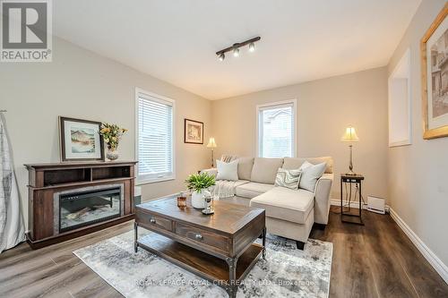 #36 -20 Shackleton Dr N, Guelph, ON - Indoor Photo Showing Living Room With Fireplace