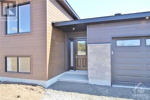 Covered front entrance - 807 Pine Grove Road, Lanark Highlands, ON - Outdoor With Exterior