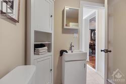 Powder Room/Laundry Room with Cabinetry and a folding counter - 