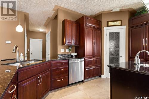 6037 Eagles Cove, Regina, SK - Indoor Photo Showing Kitchen With Double Sink