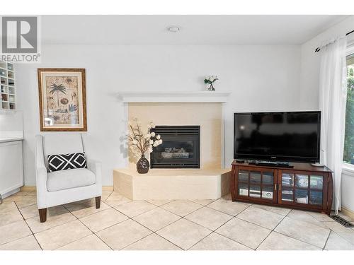 3941 Gallaghers Circle, Kelowna, BC - Indoor Photo Showing Living Room With Fireplace
