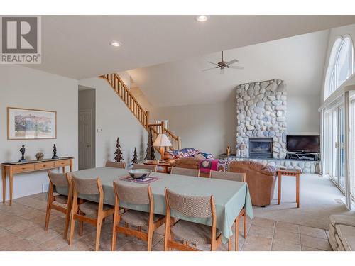 5214 Riverside Drive, Fairmont Hot Springs, BC - Indoor Photo Showing Dining Room With Fireplace