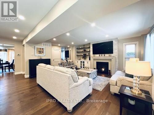 6 Edgecombe Terrace, Springwater, ON - Indoor Photo Showing Living Room With Fireplace