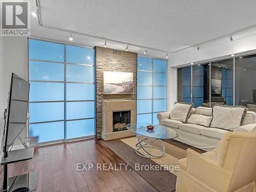#2822 -25 The Esplanade, Toronto, ON - Indoor Photo Showing Living Room With Fireplace