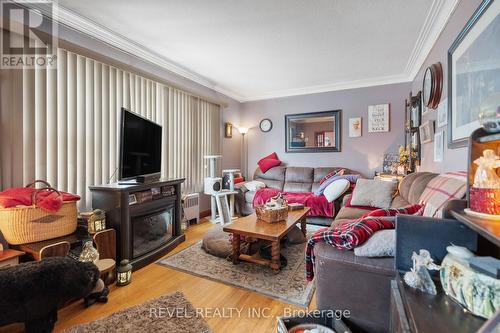 496 Carlton St, St. Catharines, ON - Indoor Photo Showing Living Room With Fireplace