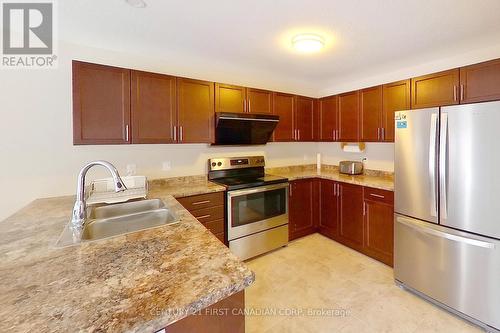 #1 -910 Reeves Ave, London, ON - Indoor Photo Showing Kitchen With Double Sink