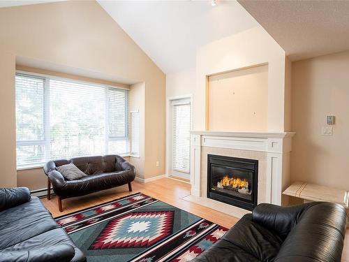 309-5625 Edgewater Lane, Nanaimo, BC - Indoor Photo Showing Living Room With Fireplace