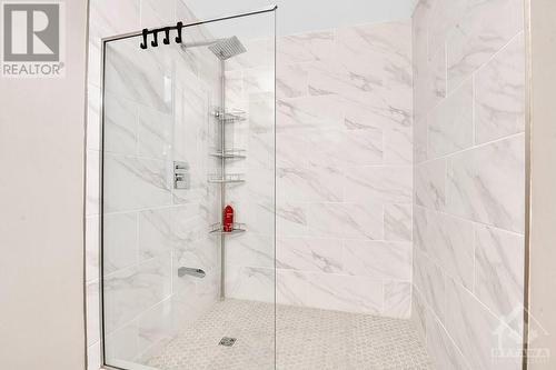 The MAIN bathroom next to the primary bedroom was totally updated with a large walk-in shower with ceramic surround and glass door, new caramic floor - 330 Royal Fern Way, Ottawa, ON - Indoor Photo Showing Bathroom