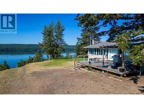 3920 Trout Drive, Lac La Hache, BC - Outdoor With Body Of Water With Deck Patio Veranda With View