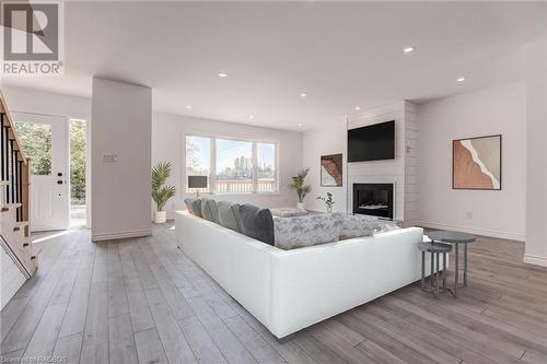 Virtually Staged - 80 Loucks Lane, Chatsworth, ON - Indoor Photo Showing Living Room With Fireplace