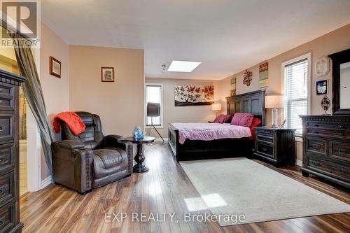 12 Benjamin St, Wilmot, ON - Indoor Photo Showing Bedroom With Fireplace