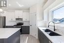 710 Bentley Manor, Saskatoon, SK  - Indoor Photo Showing Kitchen With Double Sink With Upgraded Kitchen 