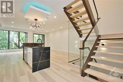 MAIN FLOOR VIEW OF STAIRCASE - 