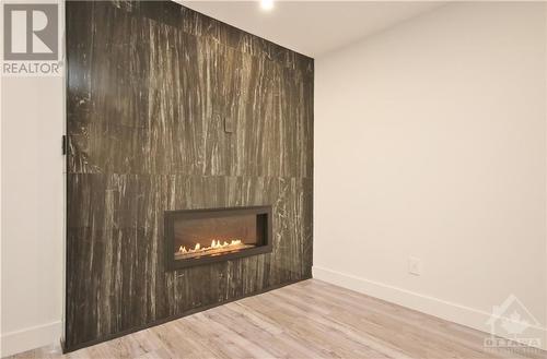 LOWER LEVEL FIREPLACE - 375 B Madison Street, Ottawa, ON - Indoor With Fireplace