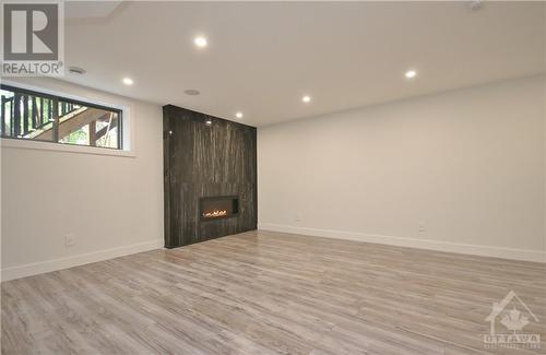 FAMILY ROOM - 375 Madison Avenue Unit#B, Ottawa, ON - Indoor Photo Showing Other Room With Fireplace