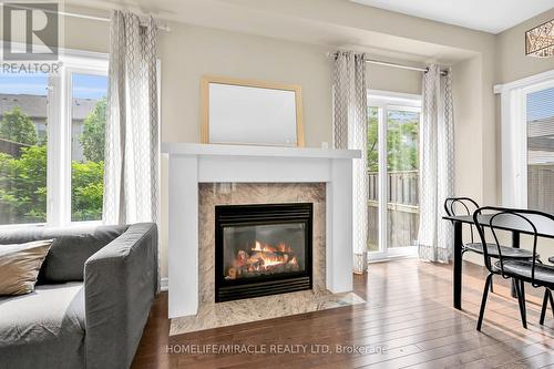 #59 -515 Winston Rd, Grimsby, ON - Indoor Photo Showing Living Room With Fireplace
