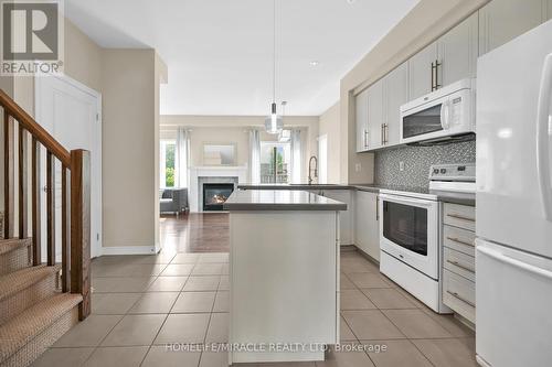 #59 -515 Winston Rd, Grimsby, ON - Indoor Photo Showing Kitchen With Fireplace