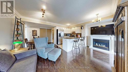 #2 -667A Warden Ave W, Toronto, ON - Indoor Photo Showing Living Room With Fireplace
