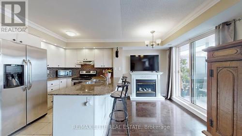 #2 -667A Warden Ave W, Toronto, ON - Indoor Photo Showing Kitchen With Fireplace With Double Sink