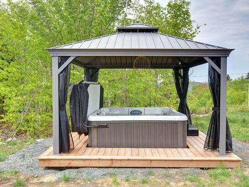 Hot tub - 150 Rue Du Denali, La Conception, QC - Outdoor With Deck Patio Veranda With Backyard