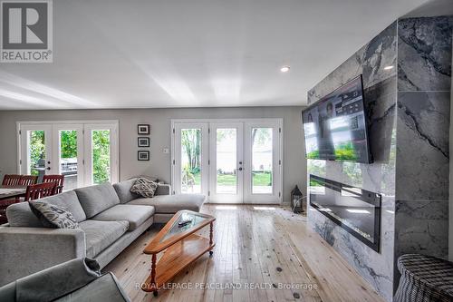 317 Riverside Drive, Kawartha Lakes, ON - Indoor Photo Showing Living Room With Fireplace