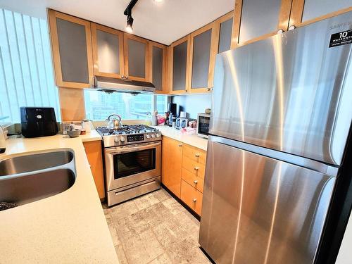 Vancouver, BC - Indoor Photo Showing Kitchen With Stainless Steel Kitchen With Double Sink