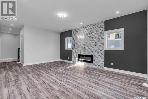 759 Delainey Court, Saskatoon, SK - Indoor Photo Showing Living Room With Fireplace