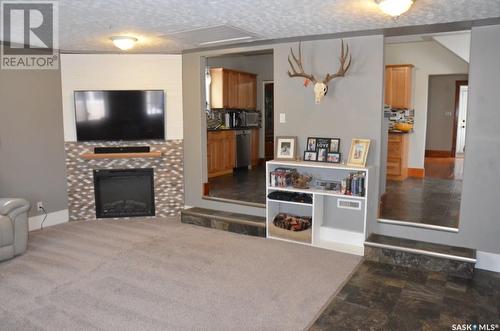 411 4Th Avenue E, Assiniboia, SK - Indoor Photo Showing Living Room With Fireplace