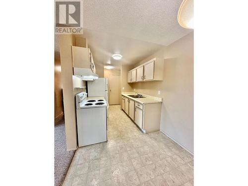 8909 92Nd Avenue Unit# 306, Osoyoos, BC - Indoor Photo Showing Kitchen With Double Sink