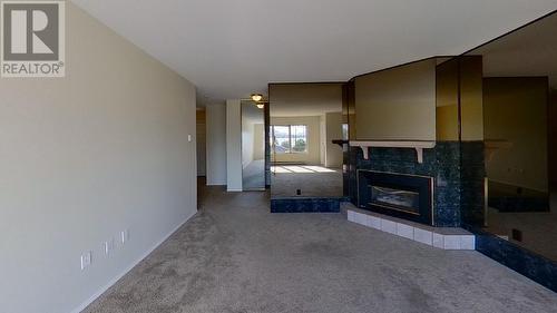 8302 68Th Avenue Unit# 304, Osoyoos, BC - Indoor Photo Showing Living Room With Fireplace
