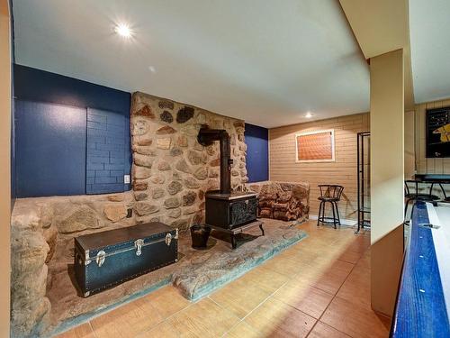 Salle familiale - 421 Av. De La Joie-De-Vivre, Chertsey, QC - Indoor Photo Showing Other Room With Fireplace