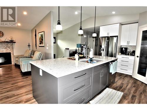 129 Deer Street, Vernon, BC - Indoor Photo Showing Kitchen With Fireplace With Upgraded Kitchen
