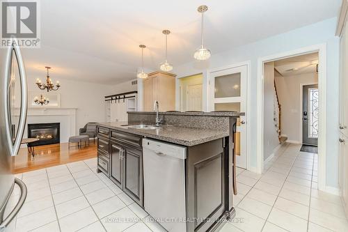 102 Downey Rd, Guelph, ON - Indoor Photo Showing Kitchen With Fireplace