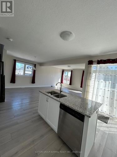 23 Drysdale Dr, Springwater, ON - Indoor Photo Showing Kitchen With Double Sink