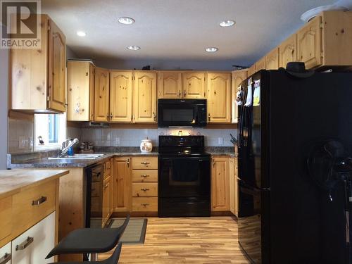 5520 Tuchodi Avenue, Fort Nelson, BC - Indoor Photo Showing Kitchen