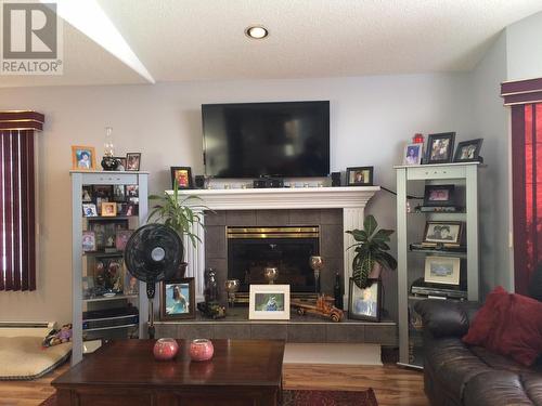 5520 Tuchodi Avenue, Fort Nelson, BC - Indoor Photo Showing Other Room With Fireplace