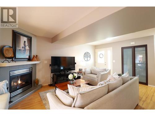 112 Regina Avenue Unit# 105, Penticton, BC - Indoor Photo Showing Living Room With Fireplace