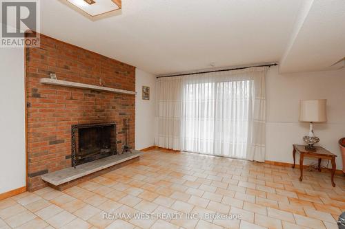 8 Marker Crt, Toronto, ON - Indoor Photo Showing Living Room With Fireplace