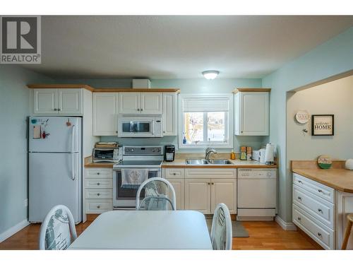 113 Stocks Crescent, Penticton, BC - Indoor Photo Showing Kitchen With Double Sink
