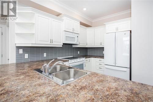 #213 -3290 New St, Burlington, ON - Indoor Photo Showing Kitchen With Double Sink