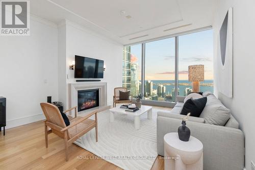 #3305 -183 Wellington St W, Toronto, ON - Indoor Photo Showing Living Room With Fireplace