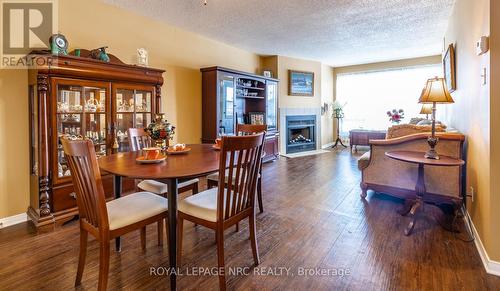 314 - 78 Roehampton Avenue, St. Catharines, ON - Indoor Photo Showing Dining Room With Fireplace